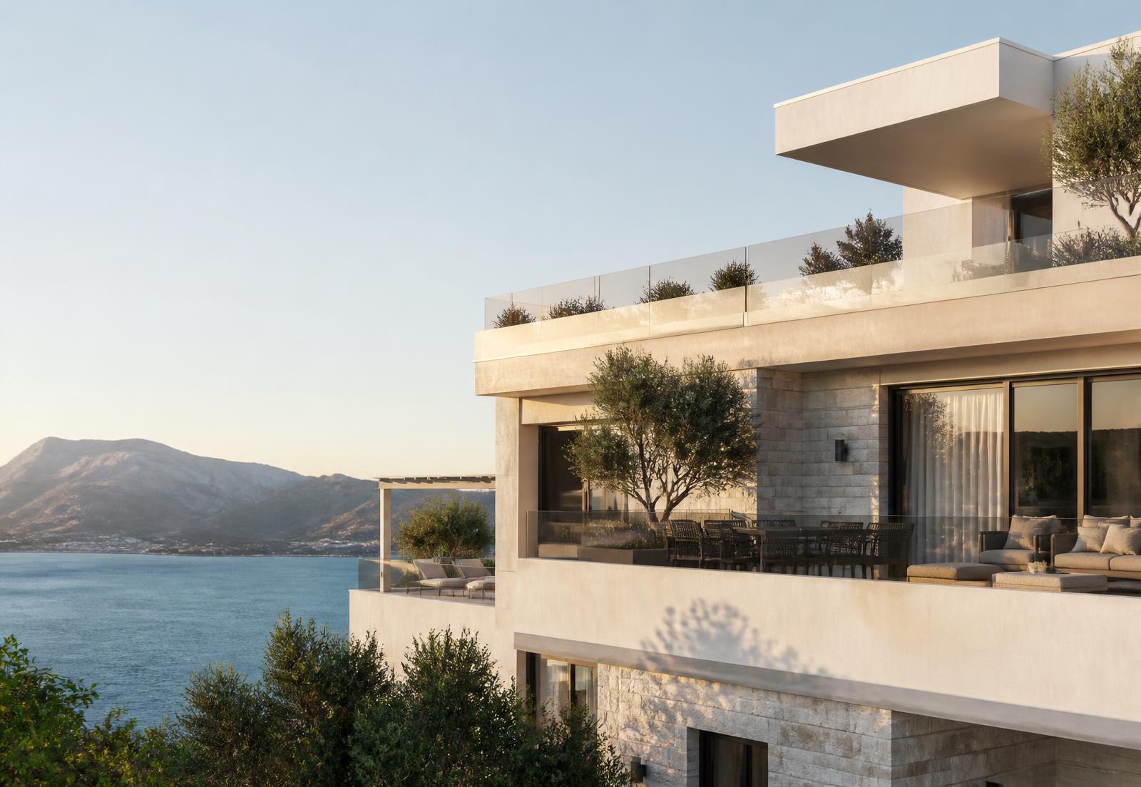Selma 1 penthouse exterior in pale stone with deep terraces above the Adriatic Sea at golden hour